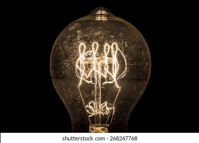 Vintage incandescent light bulb filament on black. - Powered by Shutterstock