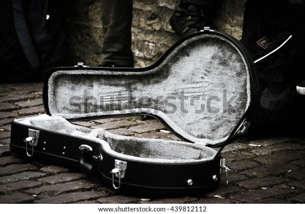 Vintage inspired buskers guitar case for money\
collection 