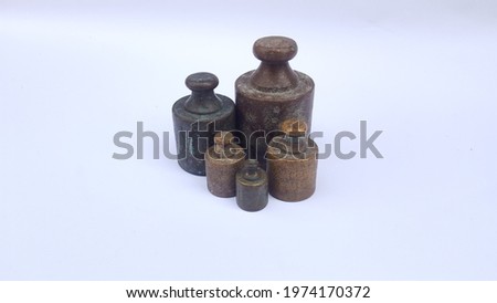 Vintage iron weights on the white background