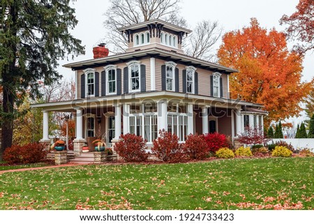 Vintage Italianate style house during autumn, architectural style popular in the 1800s 
