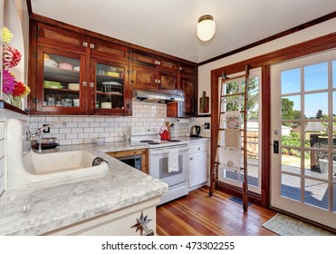 Vintage Kitchen Cabinets And White Tile Back Splash Trim. Kitchen Interior. French Doors Lead To The Back Yard. Northwest, USA