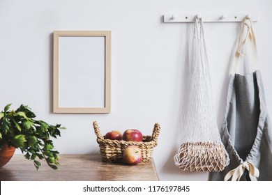 Vintage Kitchen Interior With Mock Up Photo Frame, Straw Basket, And Kitchen Accessories. Minimalistic Concept Of Kitchen Space.