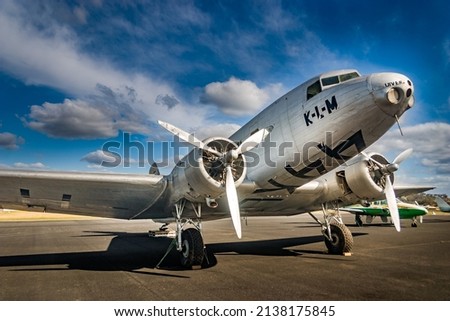 Vintage KLM DC-2 twin propeller aeroplane parked on runway