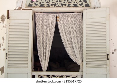 Vintage lace curtain or blind with wooden window - Powered by Shutterstock