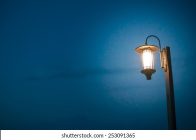 Vintage Lamp Post At Dark Night With Clear Sky