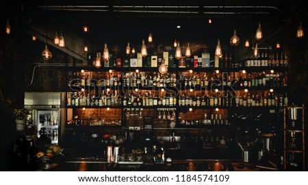 vintage lamps with blurred liquor bar 