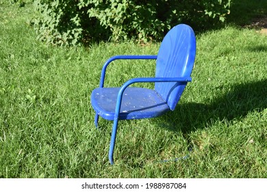 Vintage Lawn Chair In A Yard