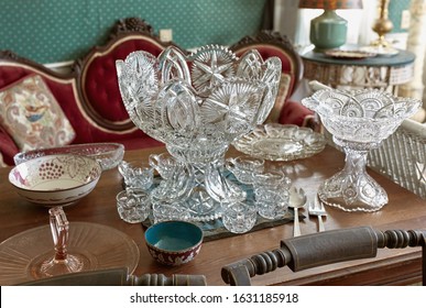 Vintage Lead Crystal Punch Bowl And Cups On A Wooden Table At An Antique Store. Maine, USA	