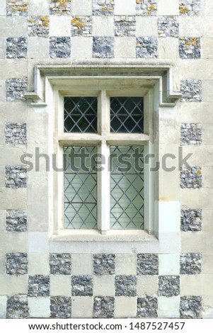 Vintage leaded window with glass panes, leadlight with checkerboard pattern