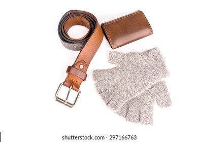 vintage leather belt and wool fingerless gloves and wallet on white background