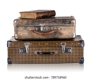 Vintage leather suitcases with book isolated on white background. The concept of time travel. - Powered by Shutterstock