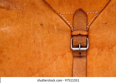 Vintage leather textured background with a belt