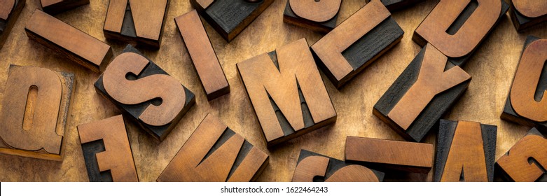 vintage letterpress wood type printing blocks, letters on handmade bark paper, panoramic banner, craftsmanship concept - Powered by Shutterstock