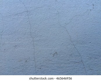 Vintage light blue paint concrete crack wall texture background