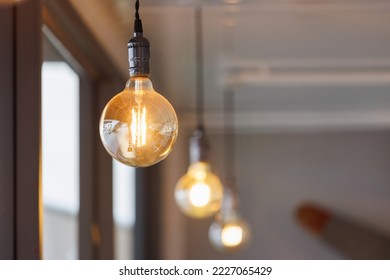 vintage light bulb hanging from ceiling for decoration in living room.