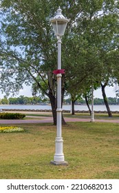 Vintage Light Pole Fixture In Park At Lake