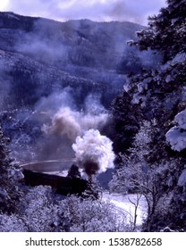 Vintage Locomotive Climbing The Incline Into The Rocky Mountains From Durango, Colorado After A Winter Snow Storm.