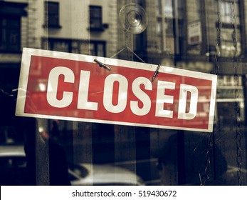 Vintage looking Closed sign in a shop showroom with reflections - Shutterstock ID 519430672