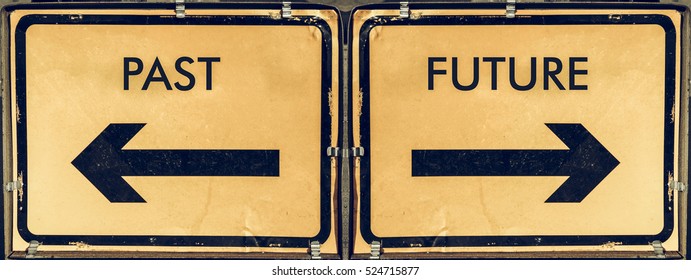 Vintage looking Direction arrow sign, back arrow meaning past, forward arrow meaning future, black over yellow background