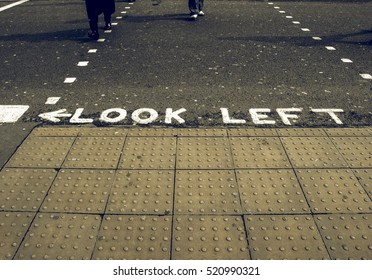 Vintage Looking Look Left Warning At A Pedestrian Zebra Crossing In A London Street