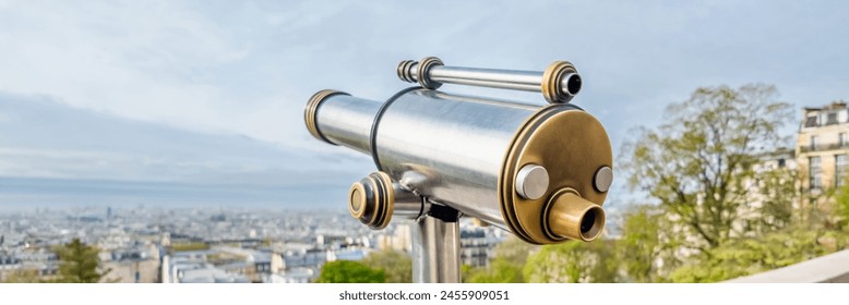 Vintage looking public telescope with expansive city view from high vantage point, ideal for urban exploration and travel themes Related concepts, tourism, sightseeing - Powered by Shutterstock