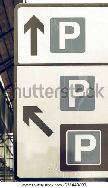 Vintage looking road sign\
parking area
