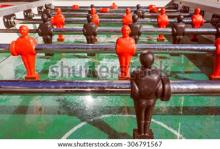 Vintage looking Table football aka table soccer, foosball from the German Tischfussball, baby-foot or kicker table-top game and sport