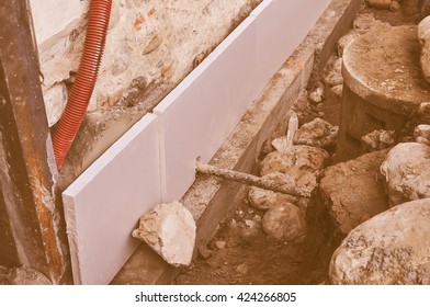 Vintage looking Underpinning for strengthening the foundation of an existing building - Shutterstock ID 424266805