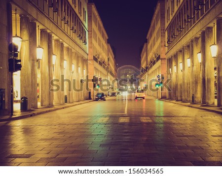 Vintage looking Via Roma, central highstreet in Turin, Italy - at night