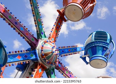 Vintage Luna park, old school rides. Carousel, children's train, parachutes, amusement park. Bright picture - vacation with children. A place for text.