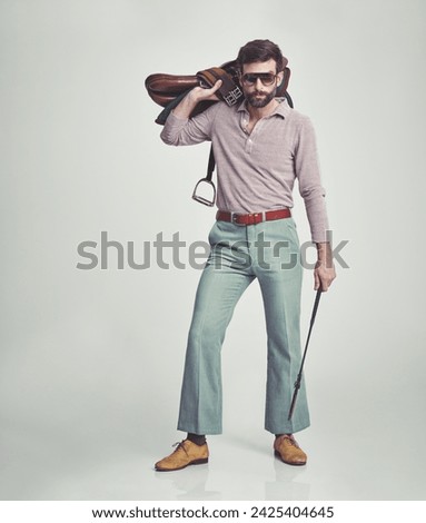 Vintage, man and saddle with riding crop in studio for hobby, leisure and confidence with sunglasses. Equestrian, person and 70s style, hipster clothes or retro outfit for fashion on white background Stock photo © 