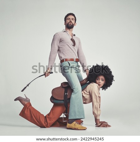 Vintage, man and woman or riding crop in studio with piggyback, portrait and funny face for retro style. Friends, people and 70s outfit with hipster clothes or comic expression with white background Stock photo © 