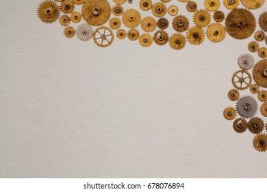Vintage manuscript industrial machinery design template. Aged cogs gears clockwork parts on white textured paper background, copy space 