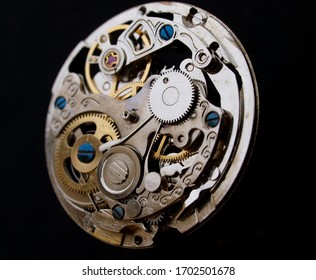 vintage mechanical watch mechanism over black surface macro detail - Powered by Shutterstock
