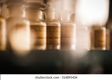 vintage medications in small bottles on a shelf