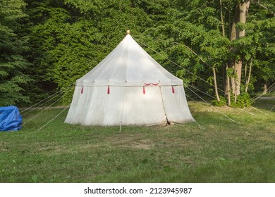 Vintage Medieval Wagons With Food And Tents On The Background Of The Forest. Medieval Bivouac Of Troops. Tents At The Outskirts Of The Castle