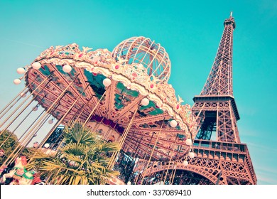 Vintage merry-go-round and the Eiffel tower, Paris France