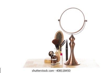 Vintage Metal Mirror And Make Up Set On Wooden Table.