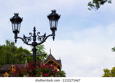 Vintage metal street lamp and blue sky