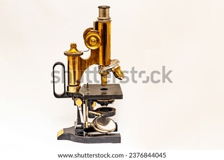vintage microscope on a white background