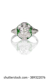 Vintage Mine Cut Engagement Art Deco Ring With Emerald Stones Isolated On White