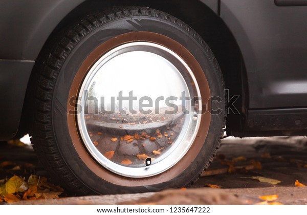 vintage
mirror car disk without spokes on the
wheel