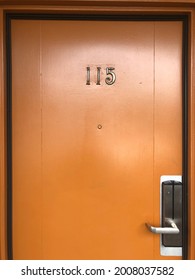 Vintage Motel Door In Orange With Room Number 115