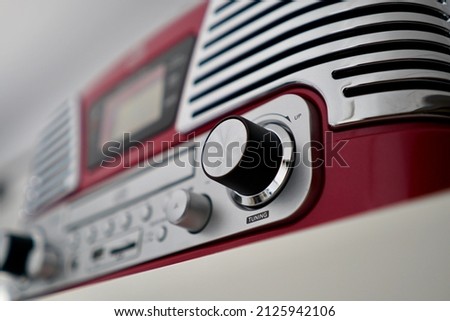 vintage music device with the cursor that moves and the word tuning.