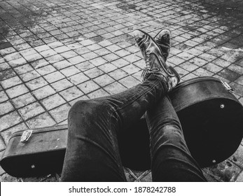 Vintage musician boots waiting on a guitar case - Powered by Shutterstock