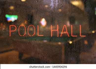 Vintage Neon Pool Hall Sign In Wet Window