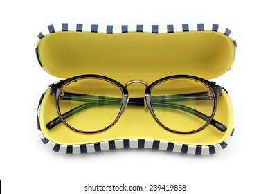 Vintage nerd glasses in the leather case over white, clipping path, Classic eyeglasses.