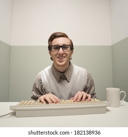 Vintage Nerd Guy Working On Old Computer In A Small Room.