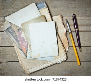 Vintage Notebook Old Papers And Pens On A Wooden Table