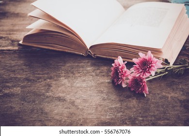 Vintage Novel Books With Bouquet Of Flowers On Old Wood Background - Concept Of Nostalgic And Remembrance In Spring Vintage Background 